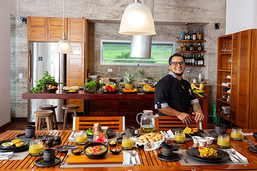 Chef of Montemar Luxury Eco Villas showing the breakfast all products from our garden