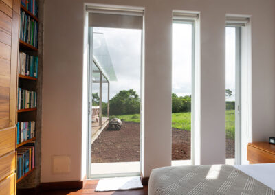 View from one of the bedrooms of Lechuza Villa, glass window and a Giant Tortoise walking around