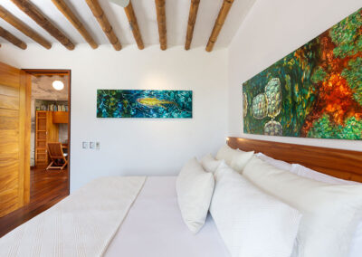 View of the super king size bed in the main bedroom of Tortuga Villa, details of the ceiling support made of bambus