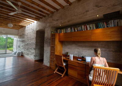 Lounge of Tortuga Villa, library and full view to outside glass window