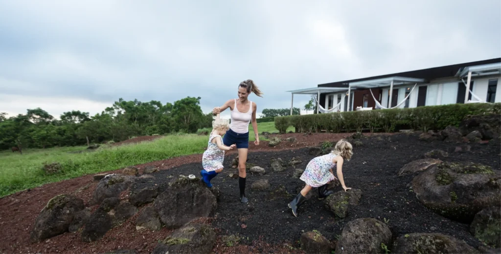 Woman and child farming on rural land.