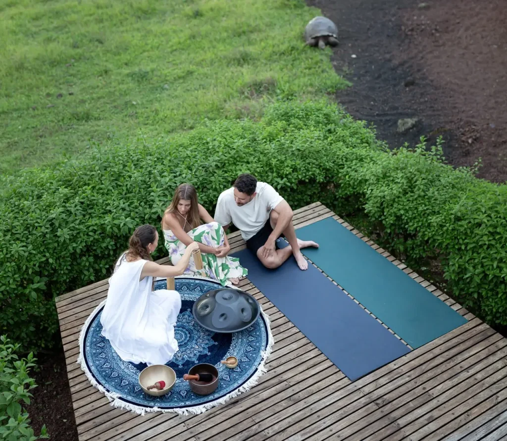 Family enjoying a close encounter with a giant tortoise at Montemar Galápagos